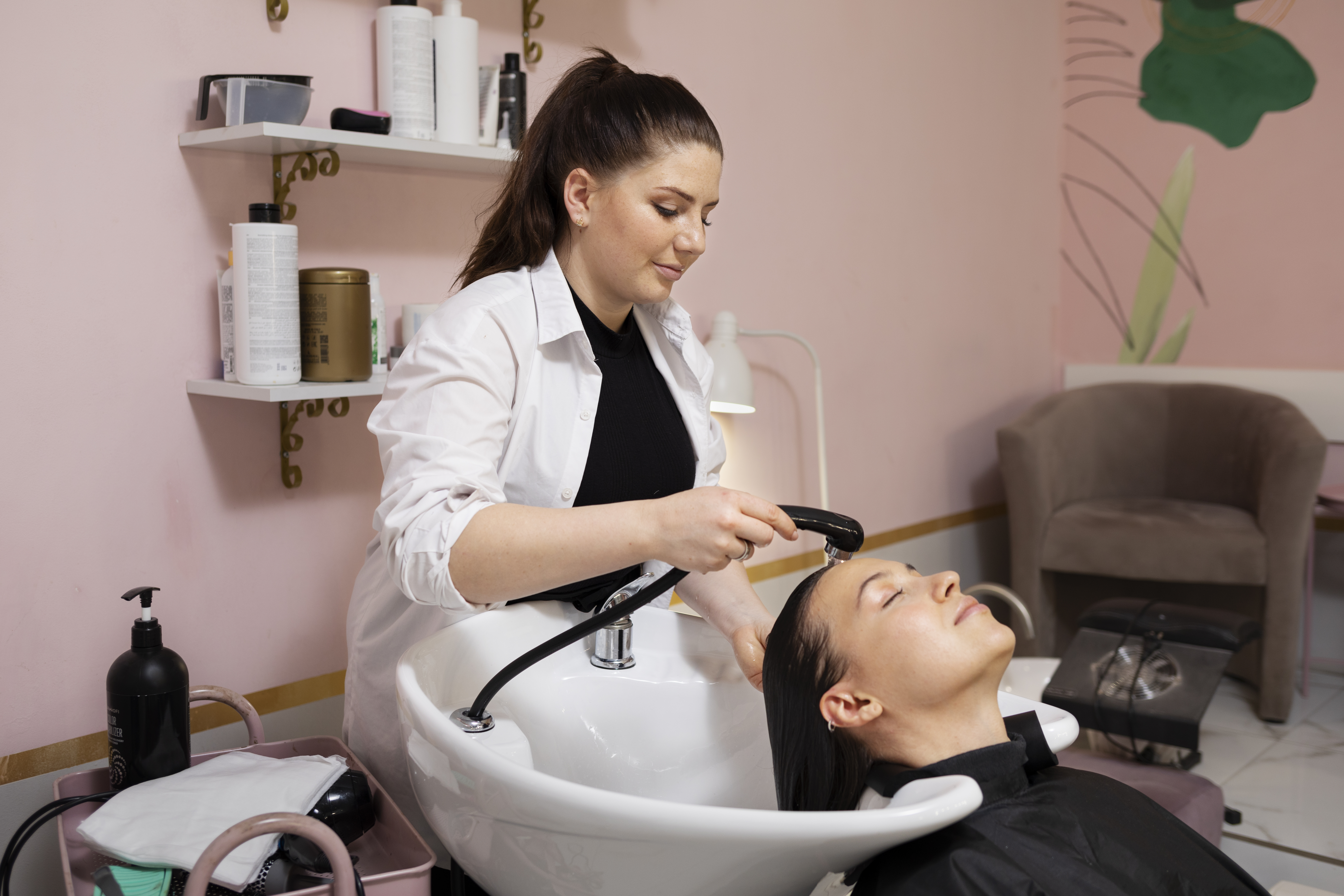 woman-getting-treatment-hairdresser-shop